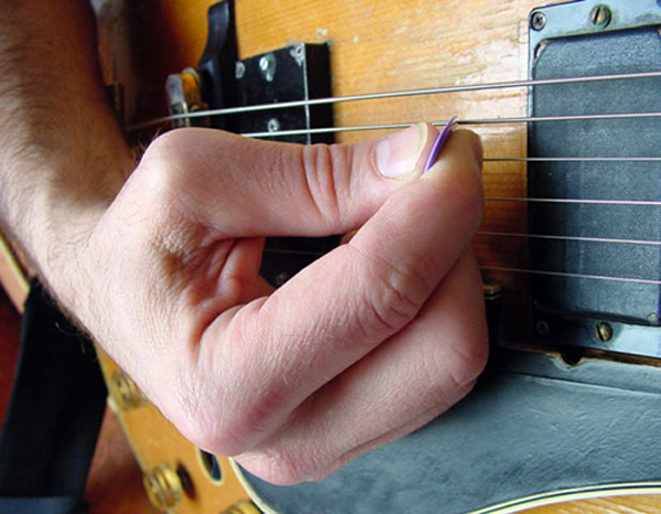 Rory's hand picking guitar